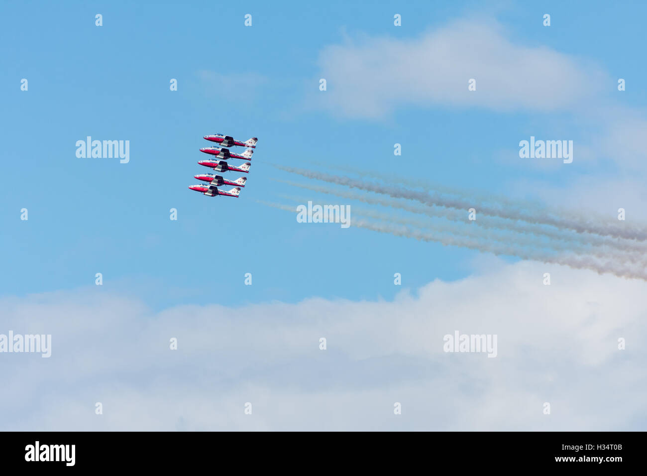 Canada SnowBirds 5 jets flying in formation smoke with trailing Stock Photo