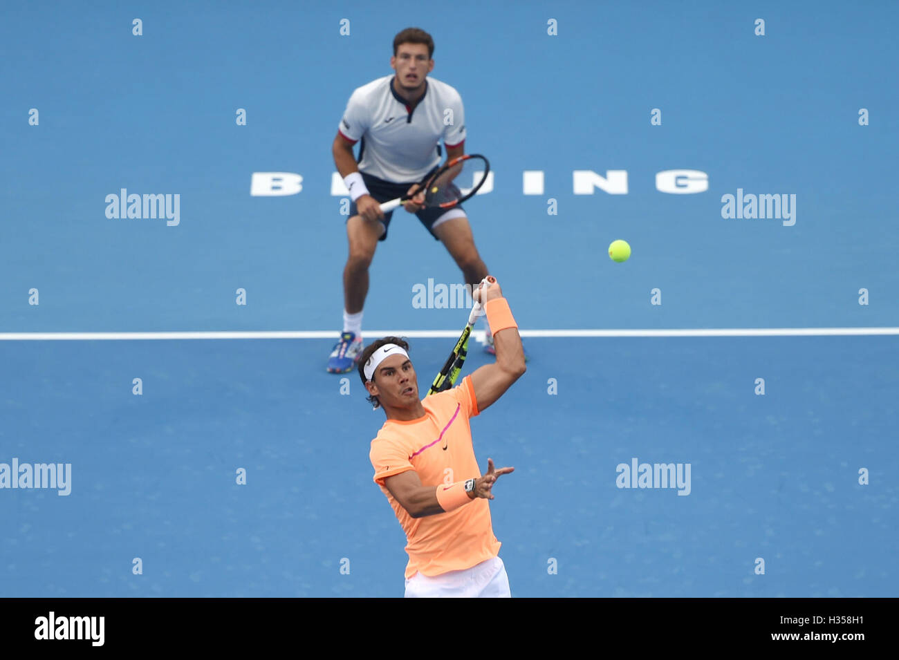 Beijing, China. 5th Oct, 2016. Rafael Nadal (Front) and Pablo Carreno Busta of Spain compete during the men's doubles quarterfinal against Gong Maoxin and Zhang Ze of China at the China Open tennis tournament in Beijing, capital of China, Oct. 5, 2016. The Spanish pair won 2-0. Credit:  Ju Huanzong/Xinhua/Alamy Live News Stock Photo