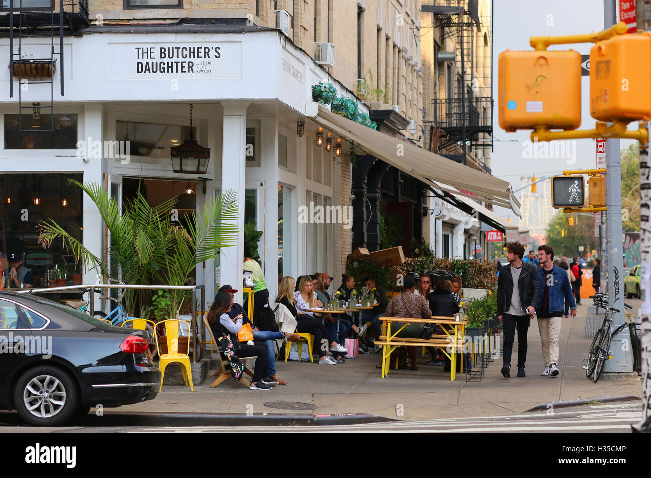 The Butcher's Daughter, 19 Kenmare St, New York, NY. exterior storefront of a plant based restaurant, and sidewalk cafe in Nolita in Manhattan. Stock Photo