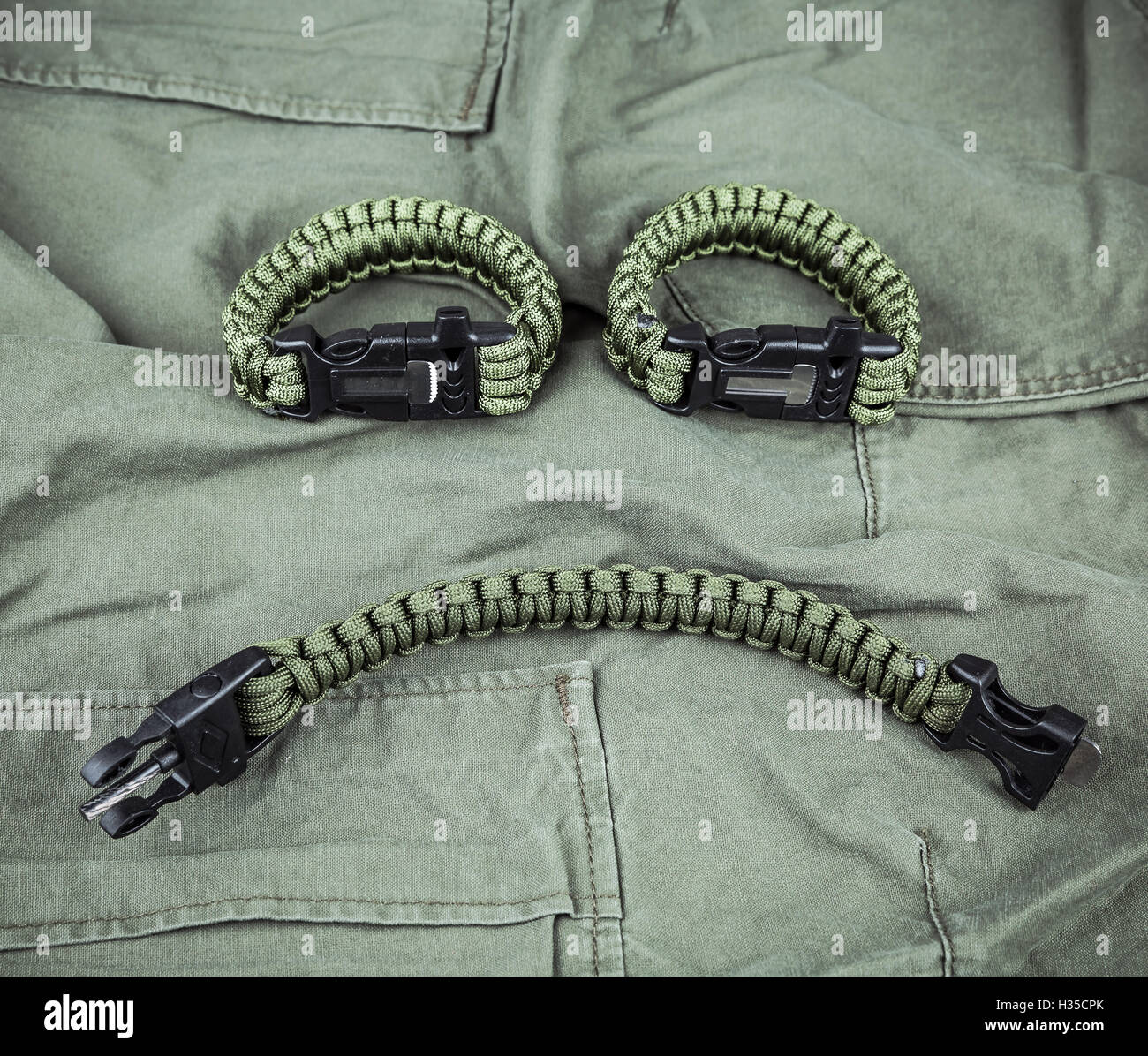 Military paracord bracelets on armygreen fabric Stock Photo Alamy