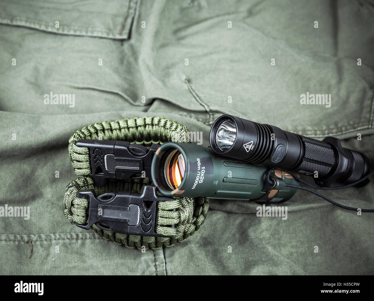 Military paracord bracelet, tactical torch and spy-glass Stock Photo - Alamy