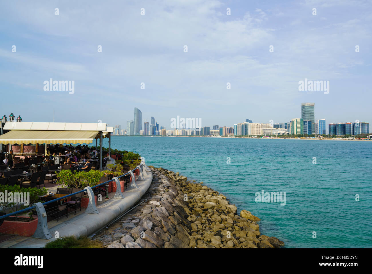 Restaurant overlooking the skyline across the Gulf, Abu Dhabi, United Arab Emirates, Middle East Stock Photo