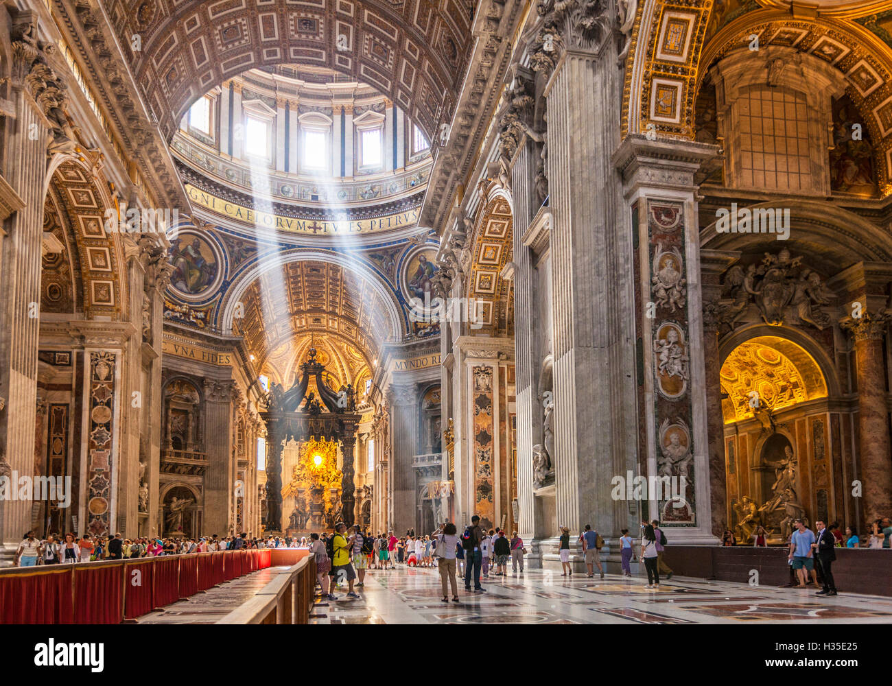 Interior of St. Peters Basilica with light shafts coming through the dome roof, Vatican City, UNESCO, Rome, Lazio, Italy Stock Photo