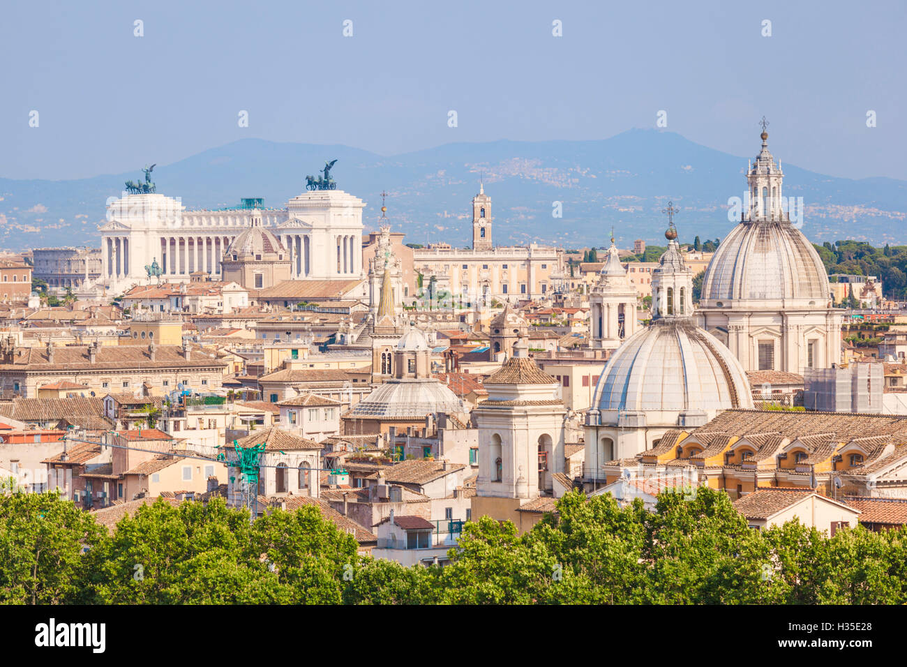 Churches and domes of the Rome skyline showing Victor Emmanuel II monument in the distance, Rome, Lazio, Italy Stock Photo
