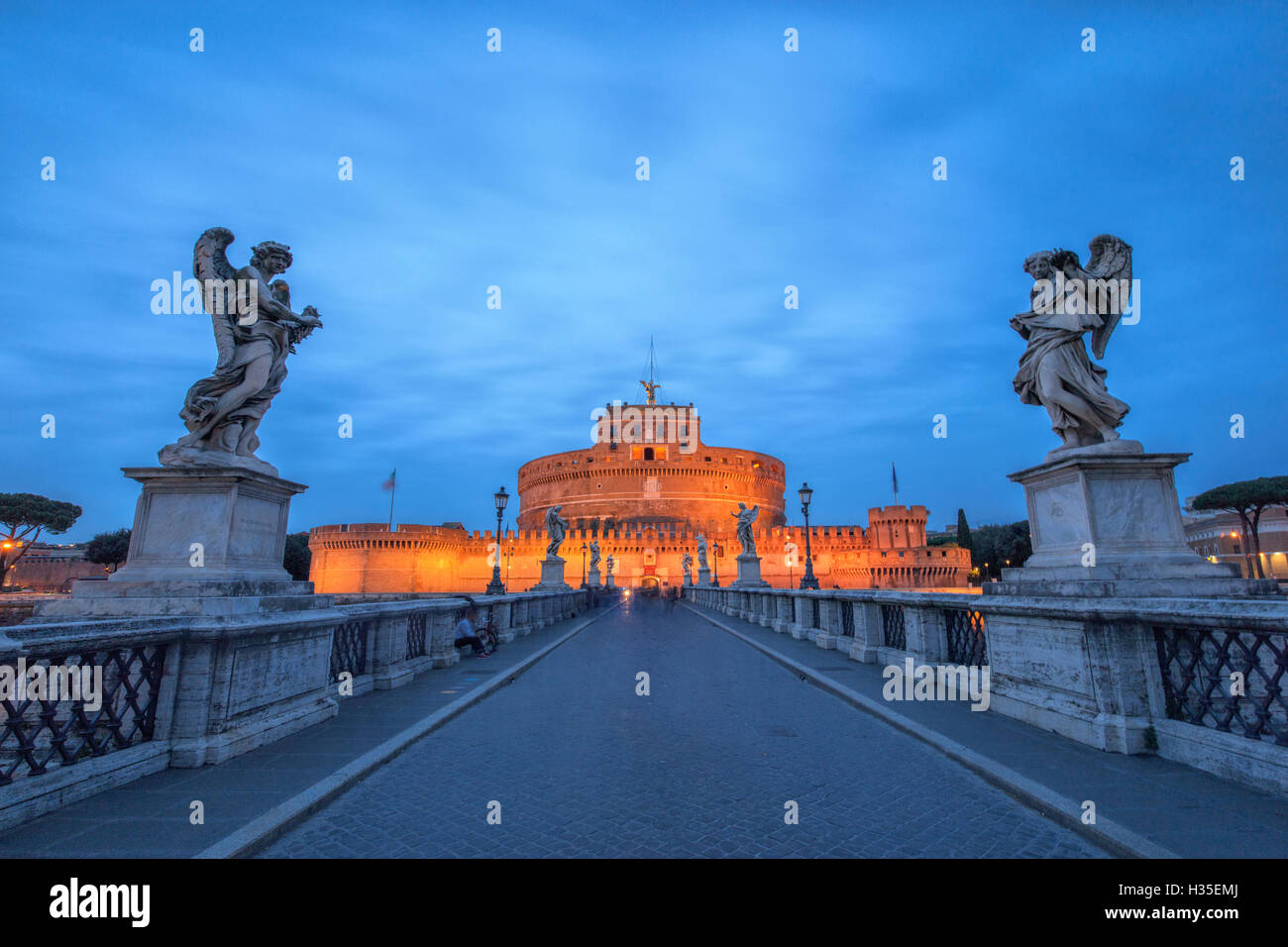 Dusk on the ancient palace of Castel Sant'Angelo with statues of angels on the bridge on Tiber RIver, UNESCO, Rome, Lazio, Italy Stock Photo