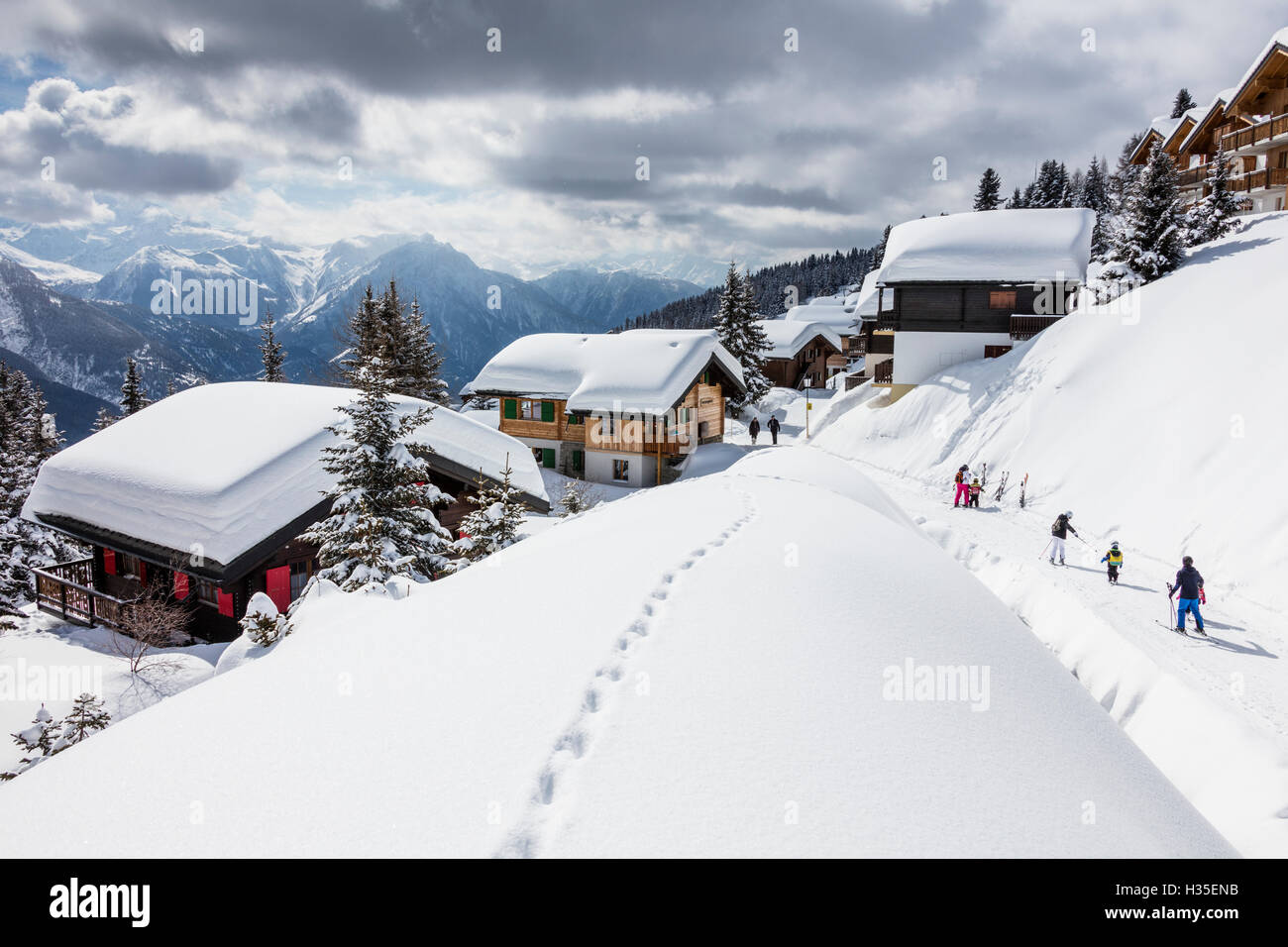 Tourists and skiers enjoying the snowy landscape, Bettmeralp, district of Raron, canton of Valais, Switzerland Stock Photo