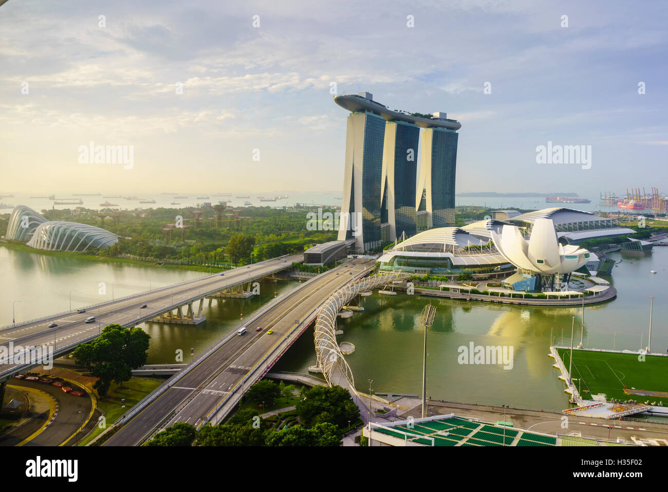 Roads leading to the Marina Bay Sands, Gardens by the Bay and ArtScience Museum at sunrise, Singapore Stock Photo