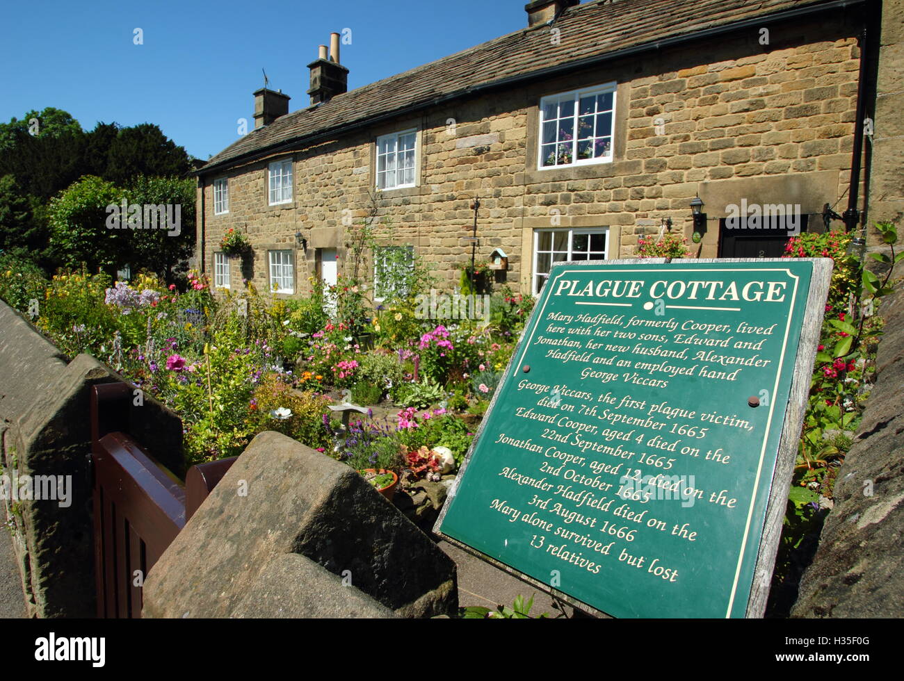 A plaque marks a 'plague cottage' in Eyam, a Derbyshire village where a