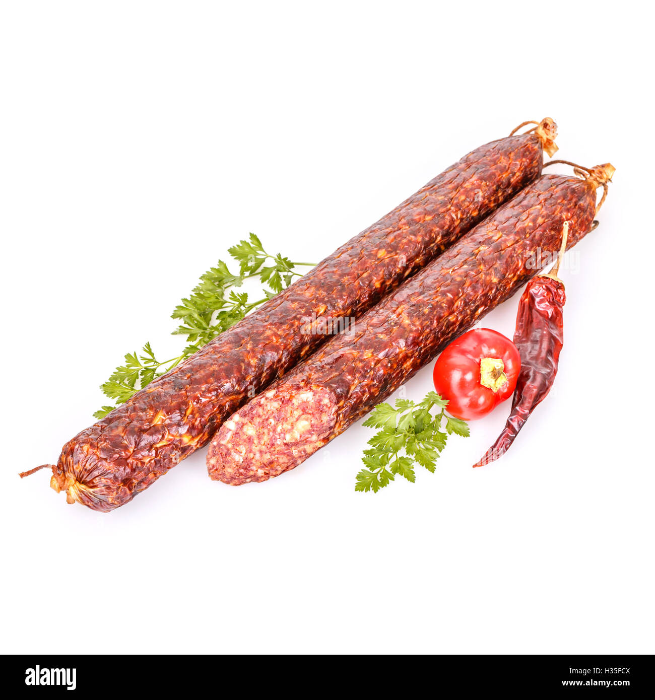 Delicious salami sticks on white background Stock Photo Alamy