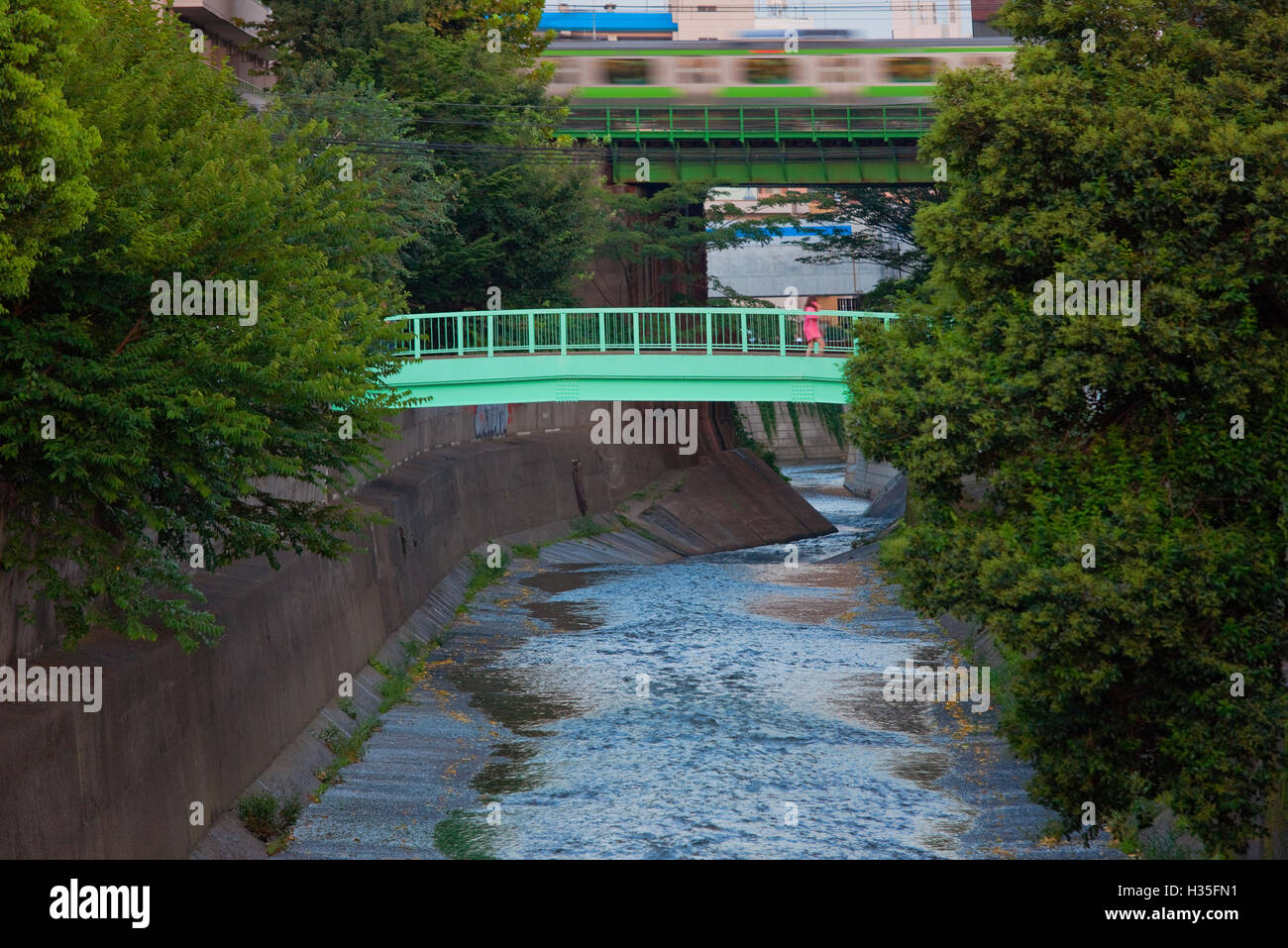 Double Track Loop A twilight view shows the Yamanote Line (a 34.5 km double-track loop ...