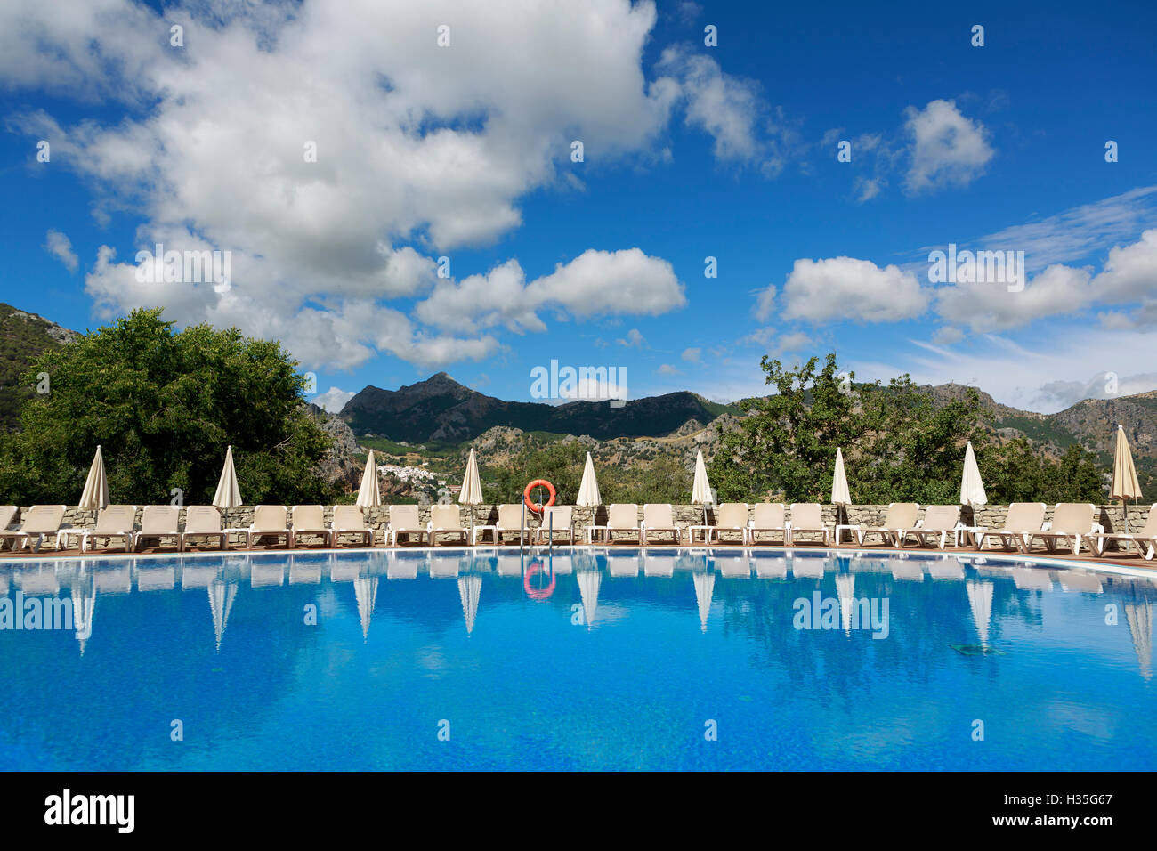 Andalusia, Spain. A general view of the pool Hotel Fuerte Grazalema in the background Parque Natural Sierra de Grazalema. Pako M Stock Photo