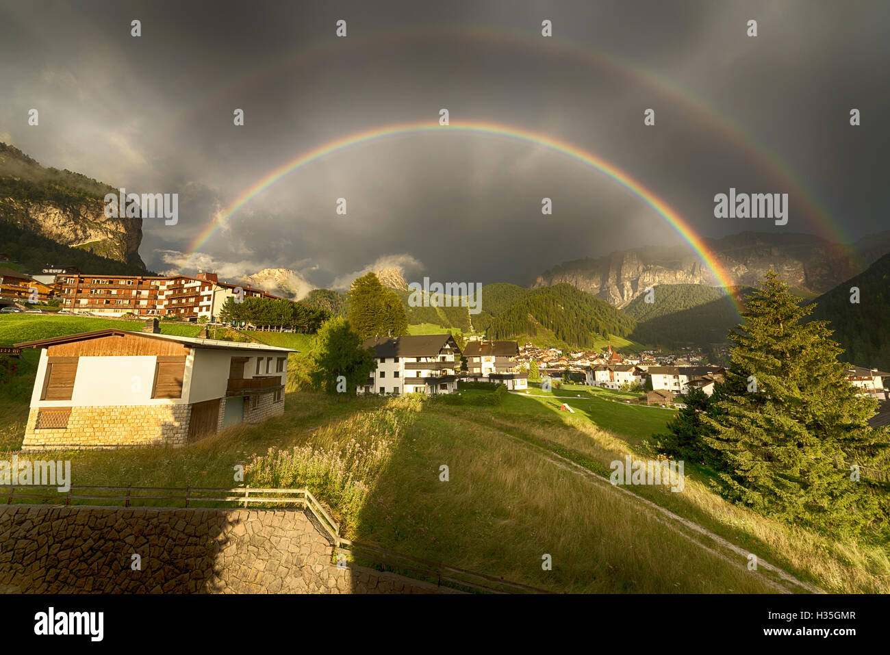 Rainbow after the thunderstorm over the Selva di Val Gardena in a summer end of the day, Trentino-Alto Adige - Italy Stock Photo