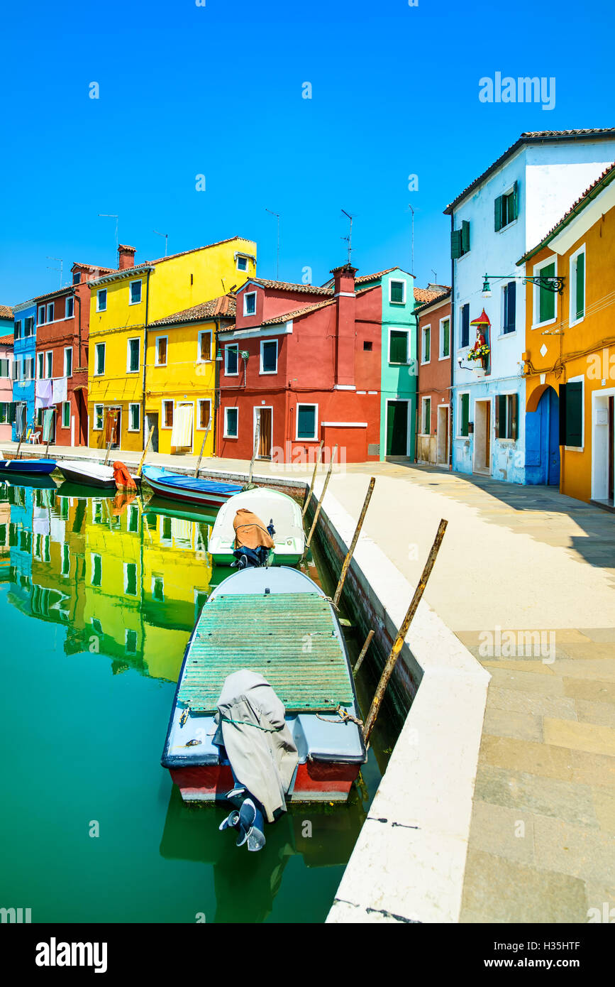 Venice landmark, Burano island canal, colorful houses and boats, Italy. Long exposure photography Stock Photo