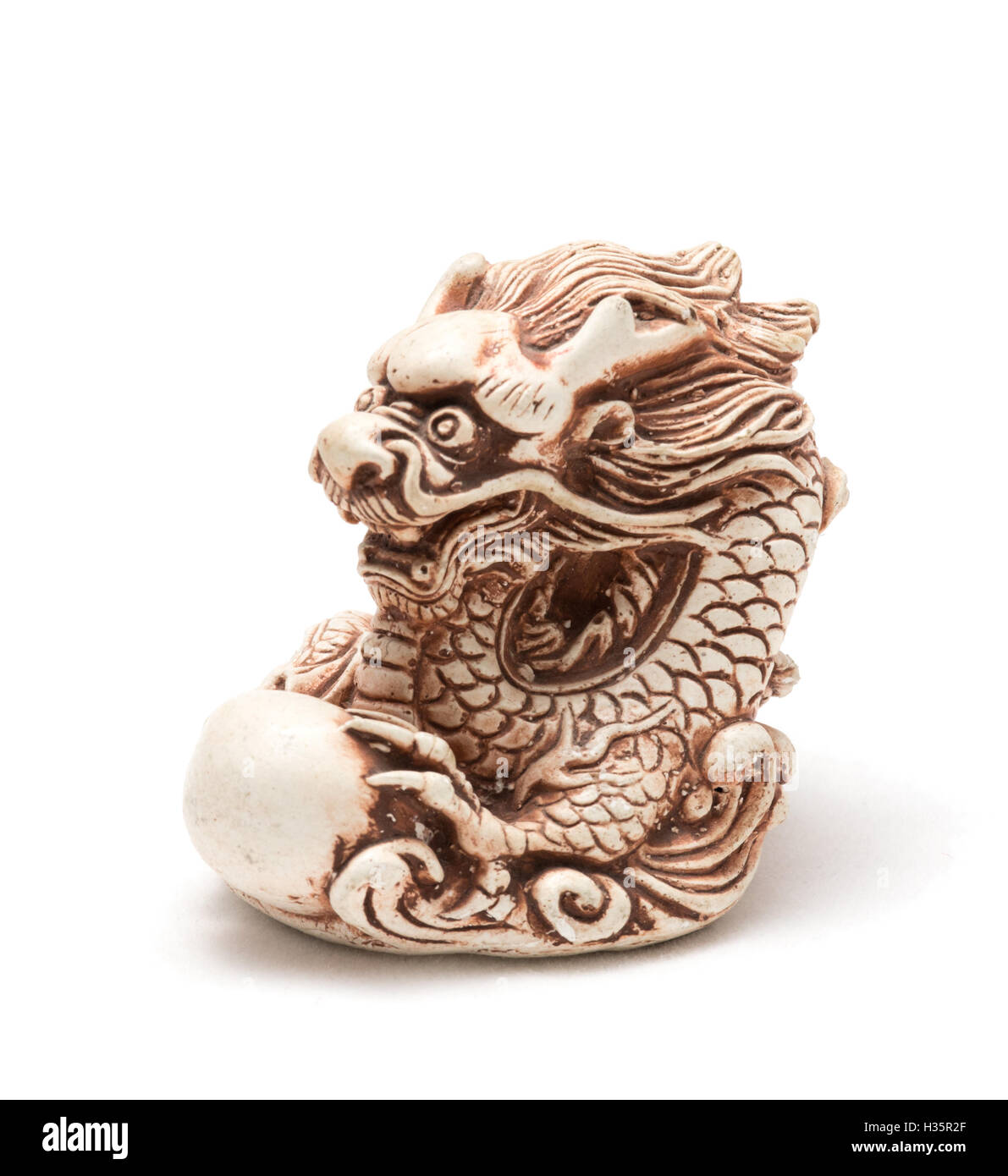 Netsuke of east dragon, which guarding the egg Stock Photo