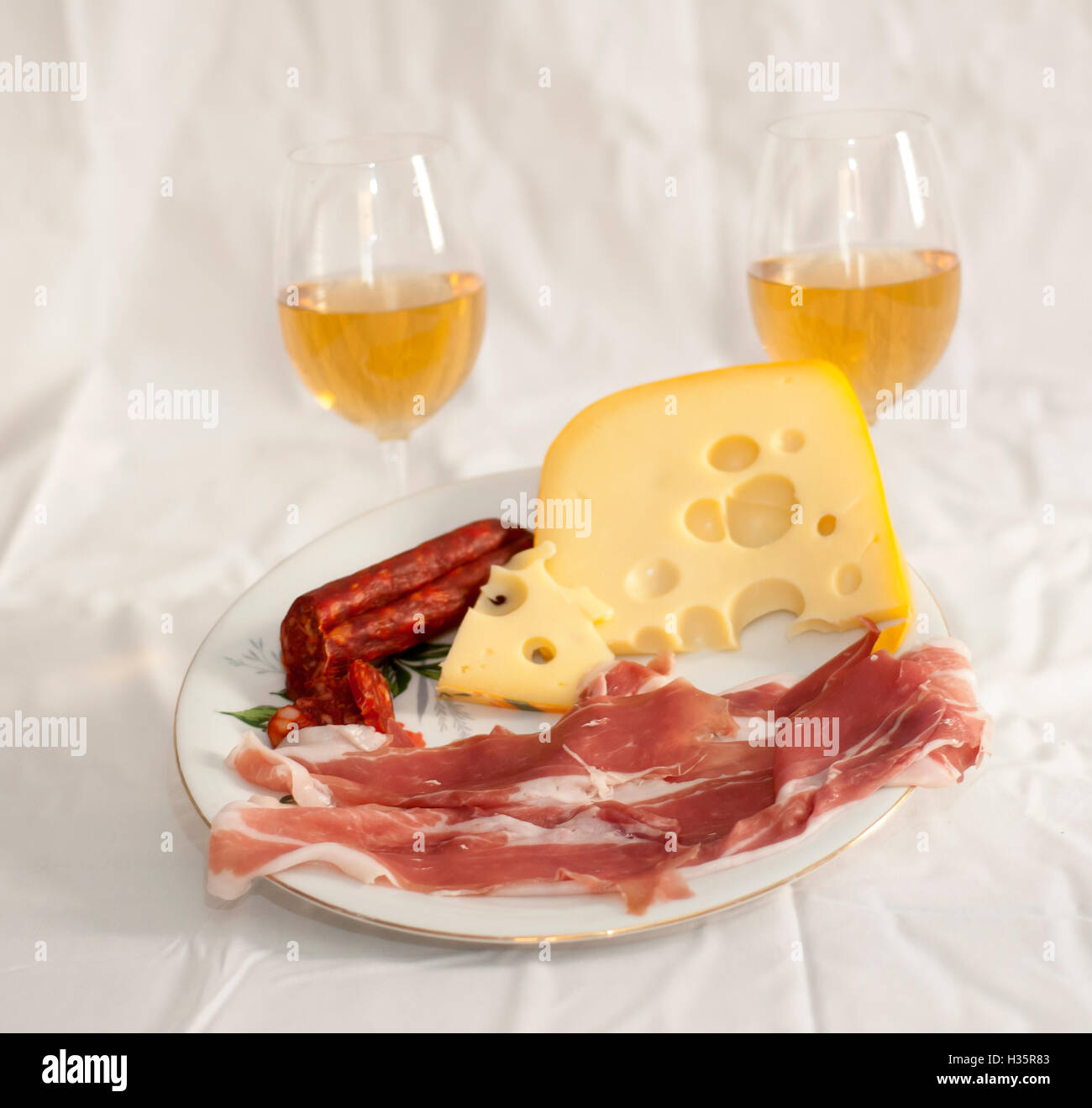 Appetizers with white wine Stock Photo