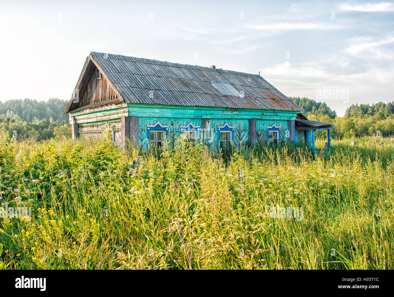 old bright green abandoned wooden house on sunny summer day Stock Photo ...