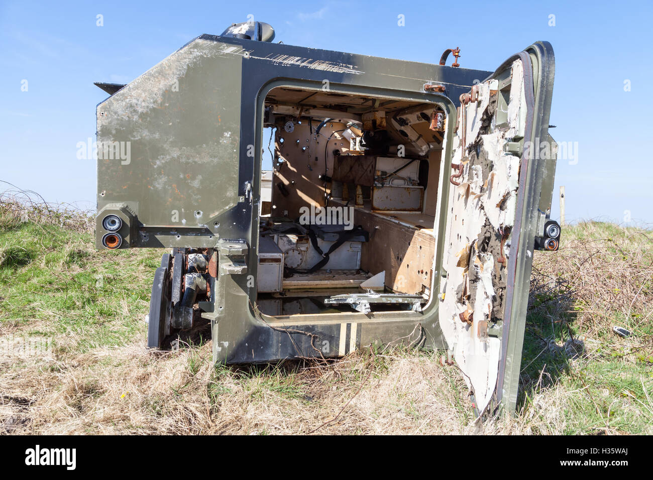Old armored vehicle used for target practice on the Castlemartin Range, Pembrokeshire, Wales Stock Photo