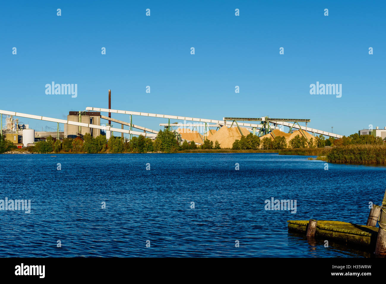 Morrum, Sweden - October 4, 2016: Industrial documentary of the Sodra Cell pulp and paper plant woodchips conveyor belts as seen Stock Photo