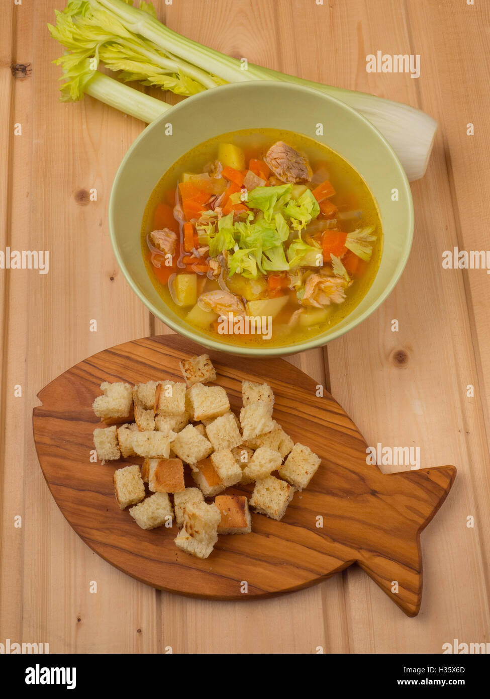 Salmon soup with croutons and celery Stock Photo