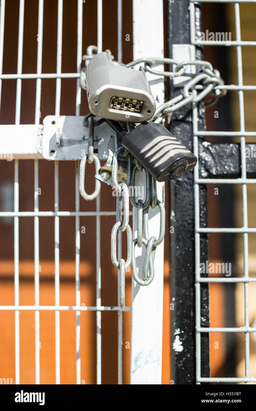 Padlocks and chains securing a local village hall Stock Photo Alamy