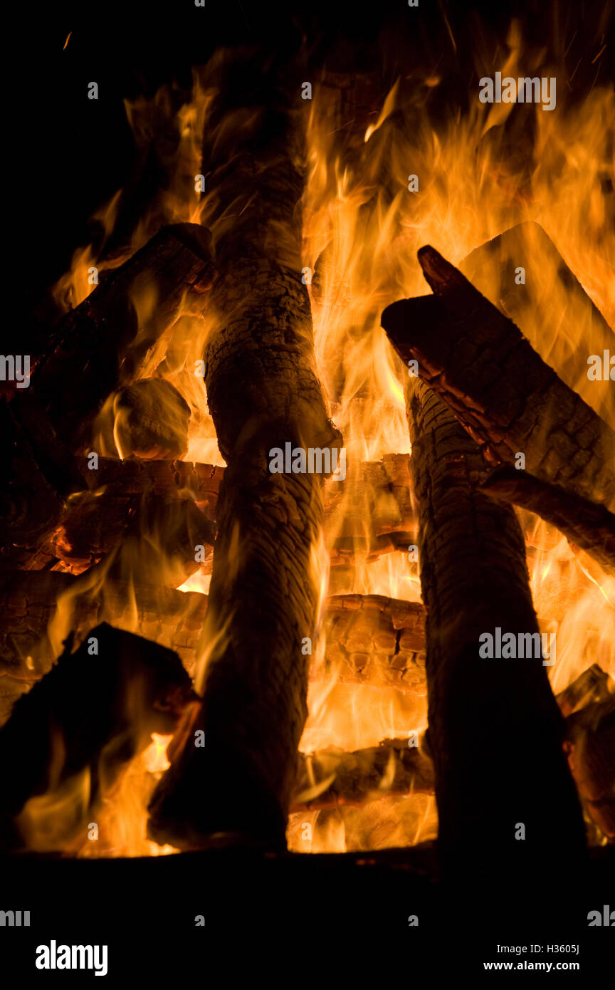 Logs, wood burning on what could be described as a funeral pyre in some ...