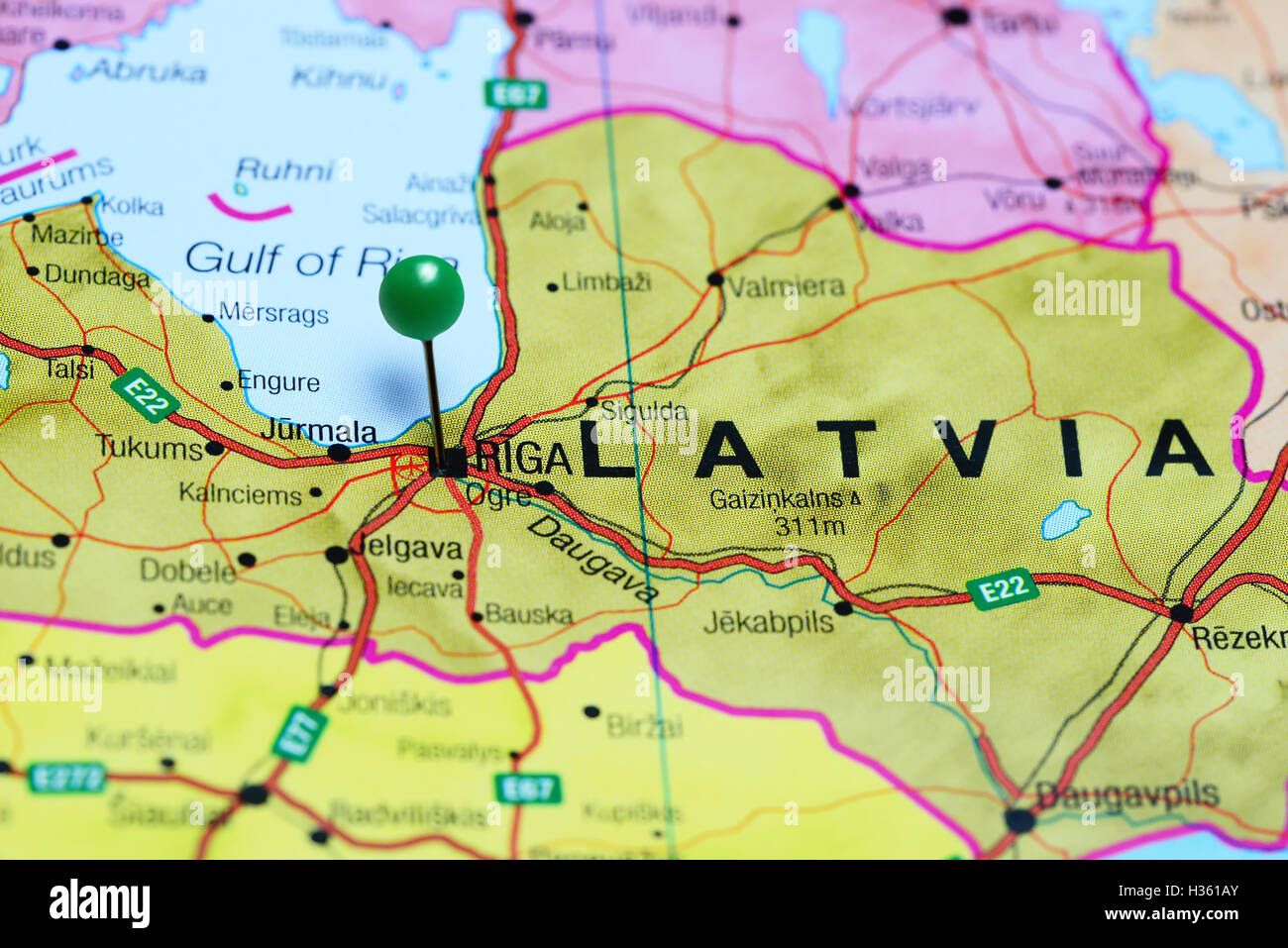 Riga pinned on a map of Latvia Stock Photo