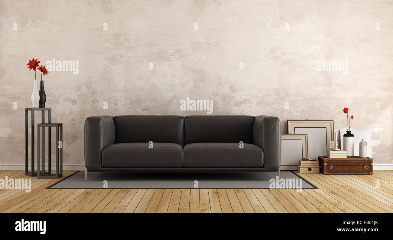 Black modern sofa in a living room with old wall and retro objects - 3d rendering Stock Photo