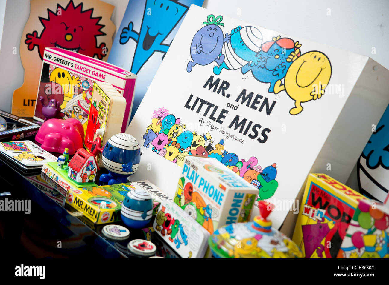 Large collection of Mr Men memorabilia including jam jar lids, board games, figures. Stock Photo