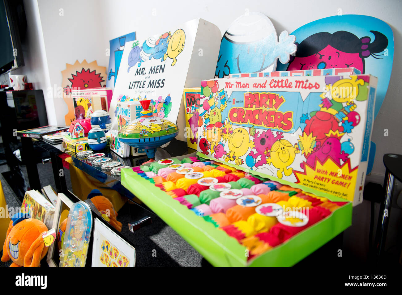 Large collection of Mr Men memorabilia including jam jar lids, board games, figures. Stock Photo