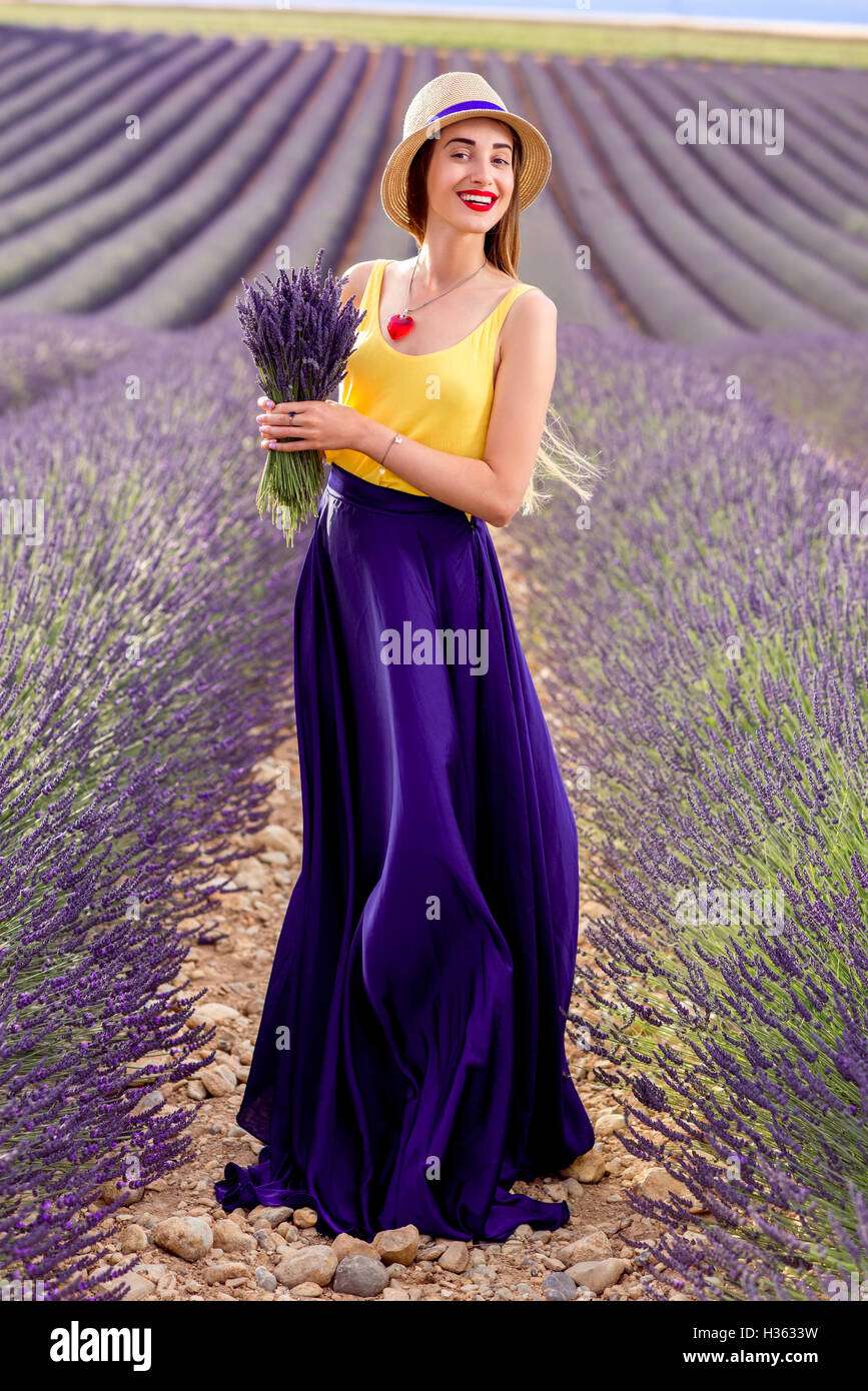 Woman with lavender in the field Stock Photo