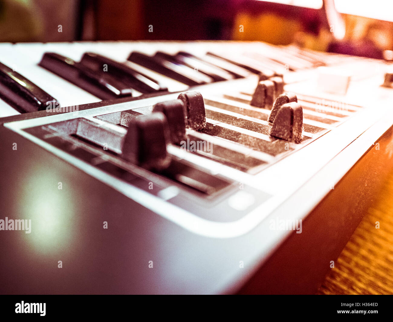Keyboard of a synthesizer with sliders Stock Photo - Alamy