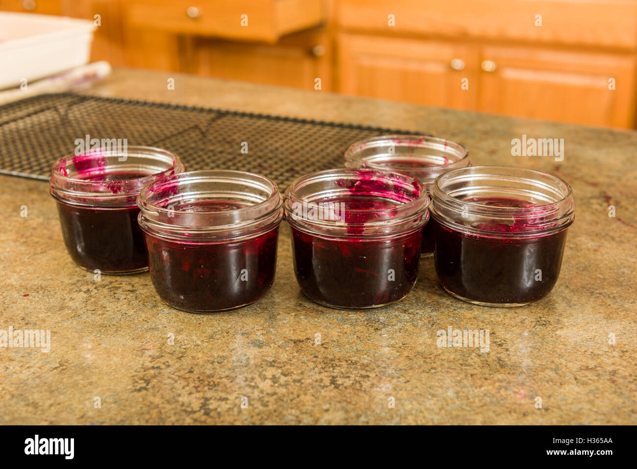 Jam ready to be sealed for storage Stock Photo Alamy