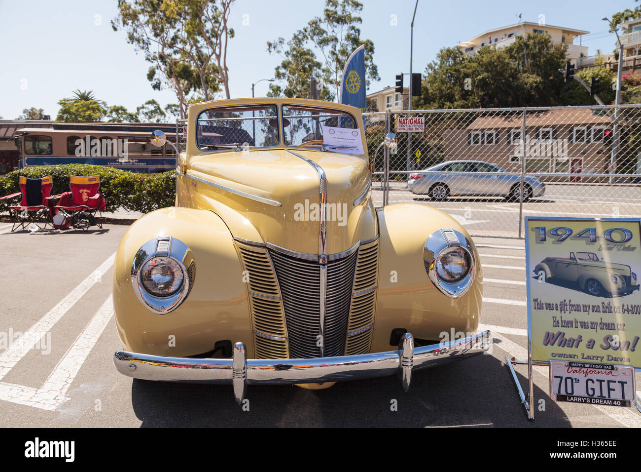 Laguna Beach, CA, USA - October 2, 2016: Yellow 1940 Ford Deluxe Convertible owned by Larry Davis and displayed at the Rotary Cl Stock Photo