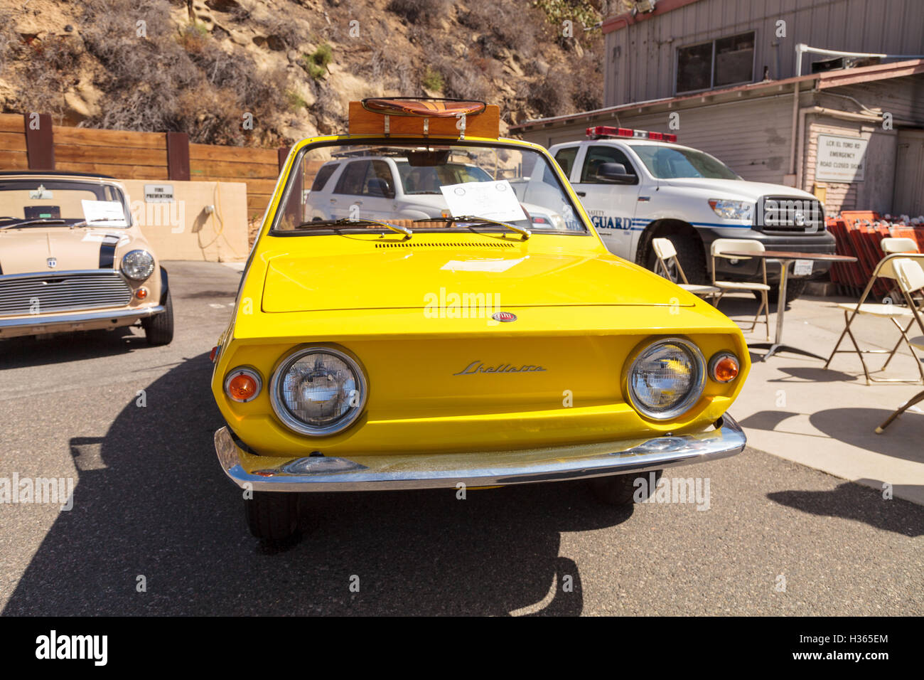 Laguna Beach, CA, USA - October 2, 2016: Yellow 1970 Fiat Schiller with wicker seats owned by Jim Roy Stock Photo