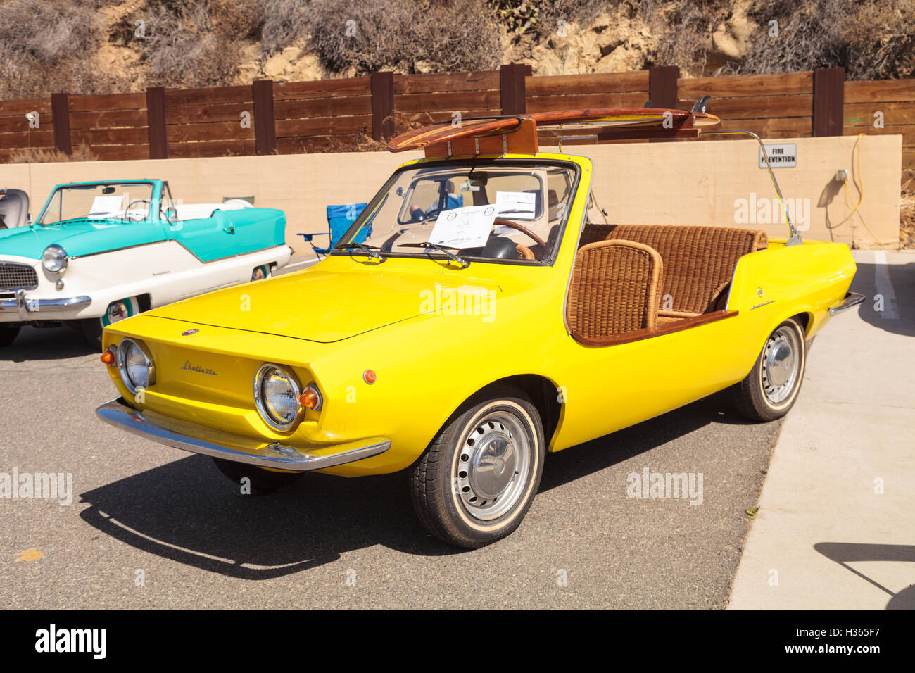 Laguna Beach, CA, USA - October 2, 2016: Yellow 1970 Fiat Schiller with wicker seats owned by Jim Roy Stock Photo