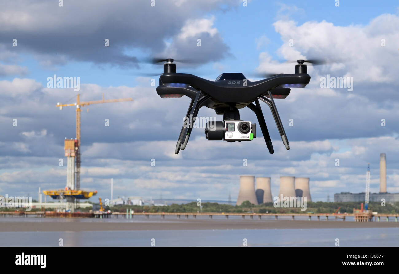 Man flying 3DR RTF X8 drone near River Mersey, Merseyside, England Stock Photo