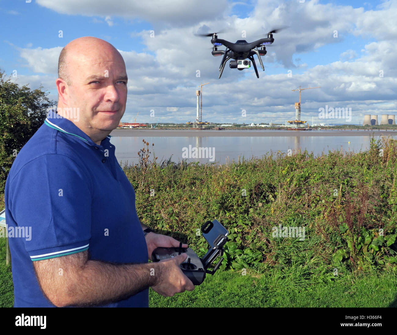 Man flying 3DR RTF X8 drone near River Mersey, Merseyside, England Stock Photo