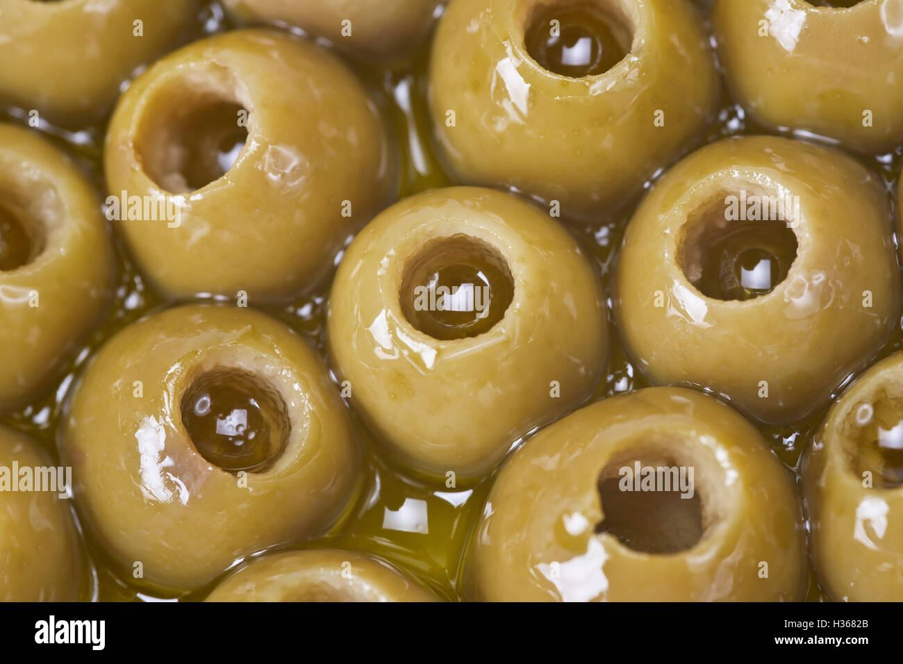 Texture of pitted olives covered in olive oil and ready to eat Stock