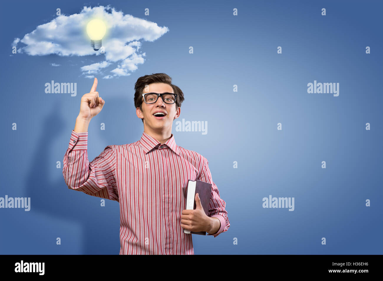 young man holding a book Stock Photo - Alamy