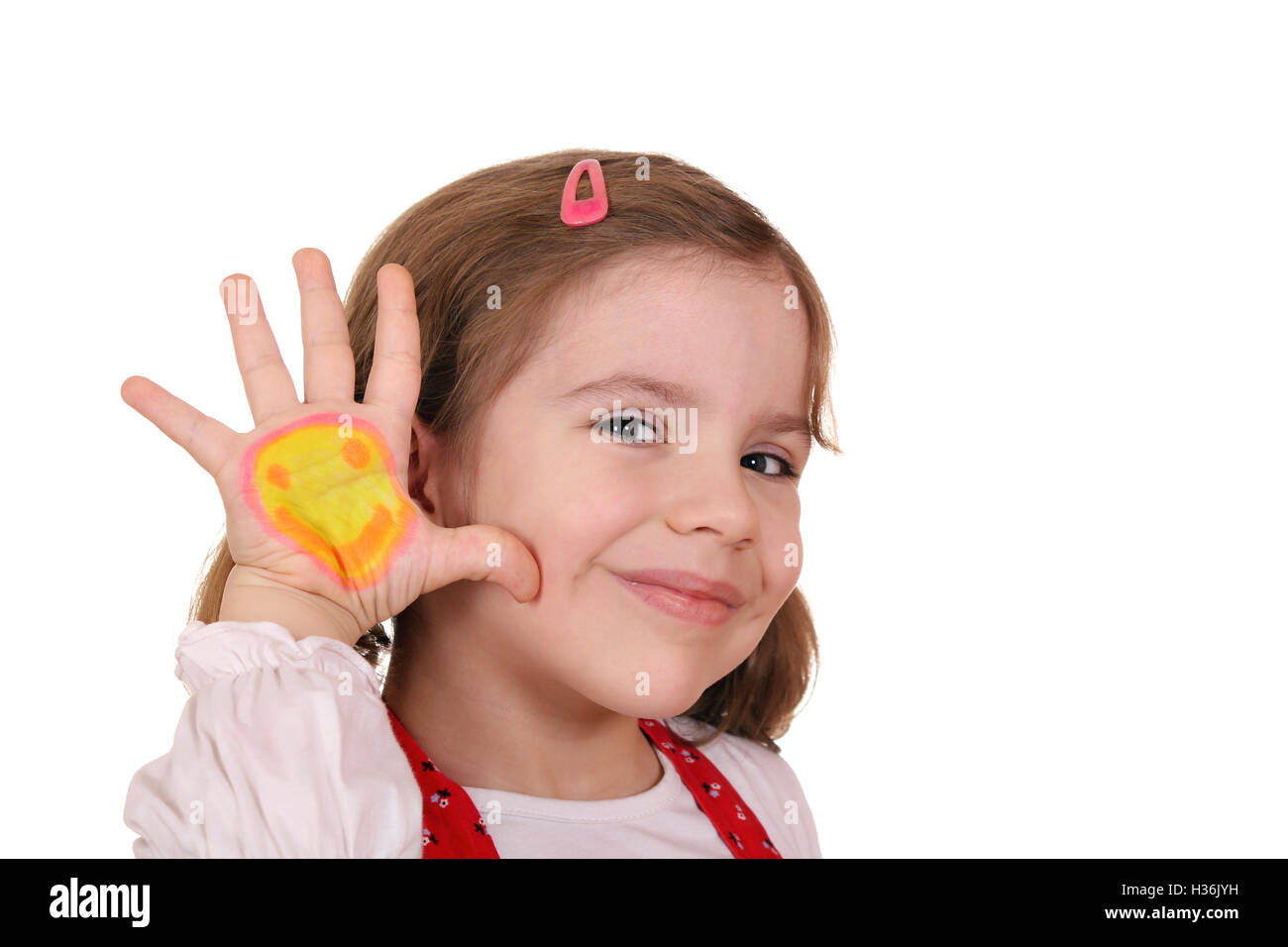 beautiful little girl with smiley on hand Stock Photo