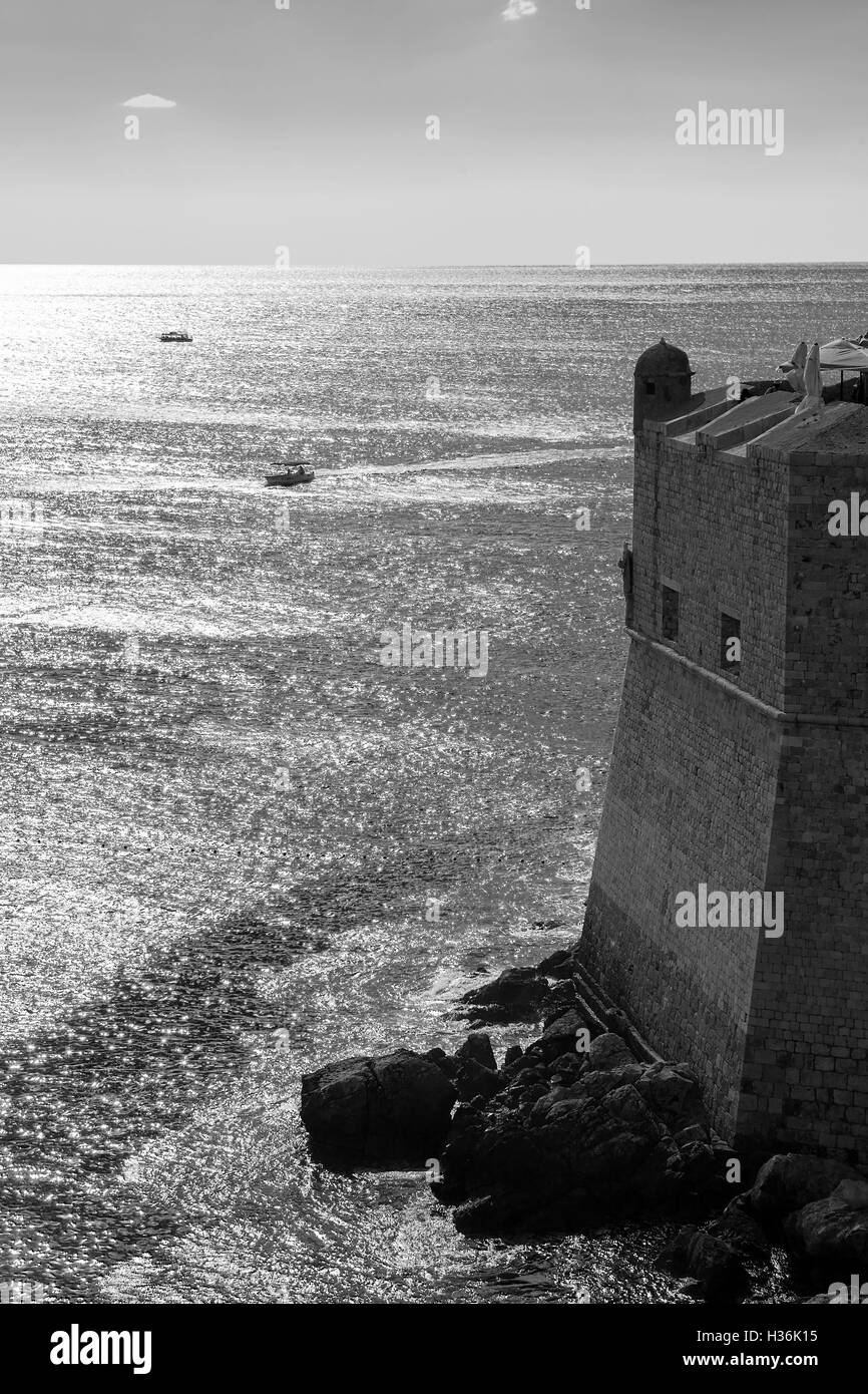 City walls and the tower of Sv Spasitelj, seen from St. John's fort, stari grad, Dubrovnik, Croatia,  Black and white version. Stock Photo