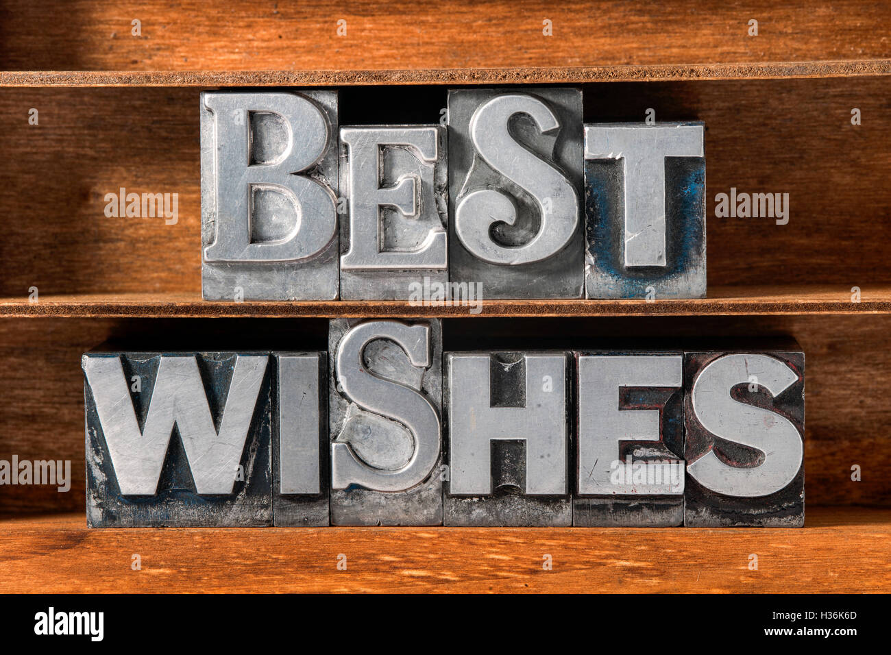 best wishes phrase made from metallic letterpress type on wooden tray Stock Photo