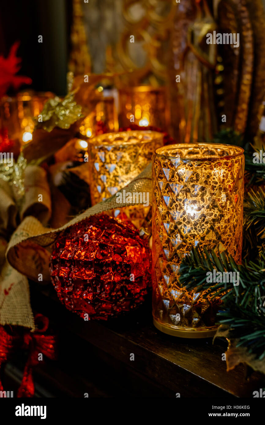 Christmas candles and decorations on a display shelf Stock Photo Alamy