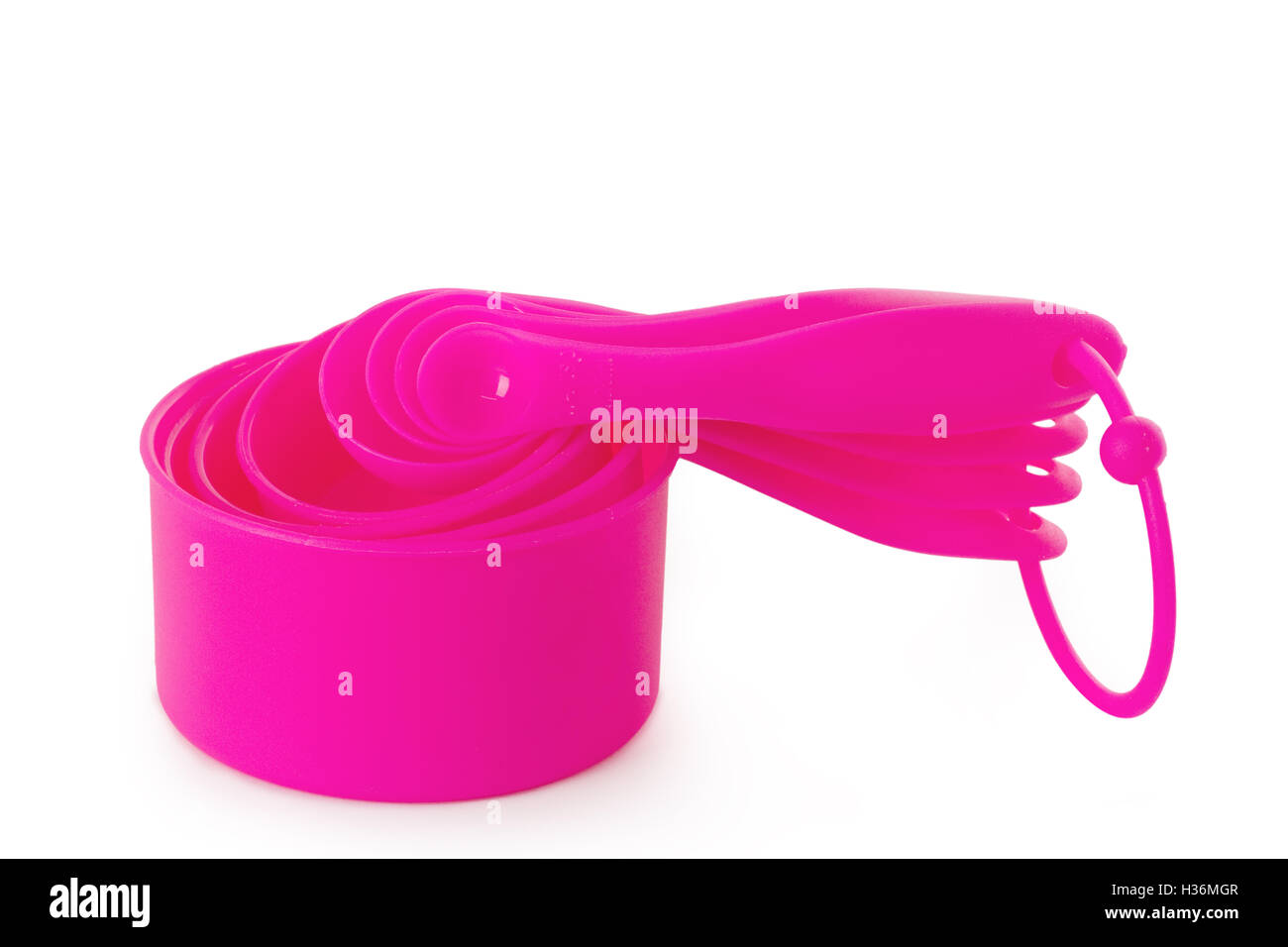 Pink measuring cups isolated on white background Stock Photo - Alamy
