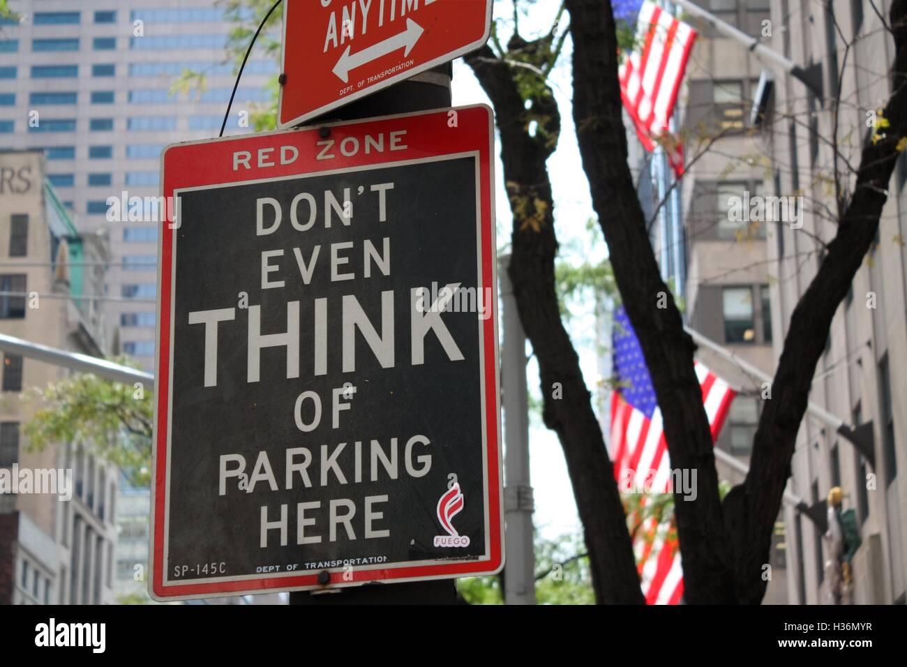 'Don't even think of parking here' street sign displayed on 5th Avenue in Midtown Manhattan on August 31st, 2016 in New York. Stock Photo