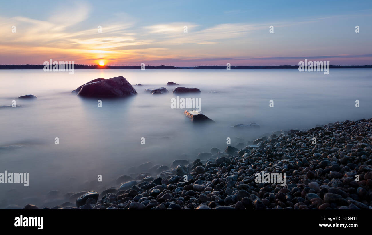 Sunset by the beach Stock Photo - Alamy