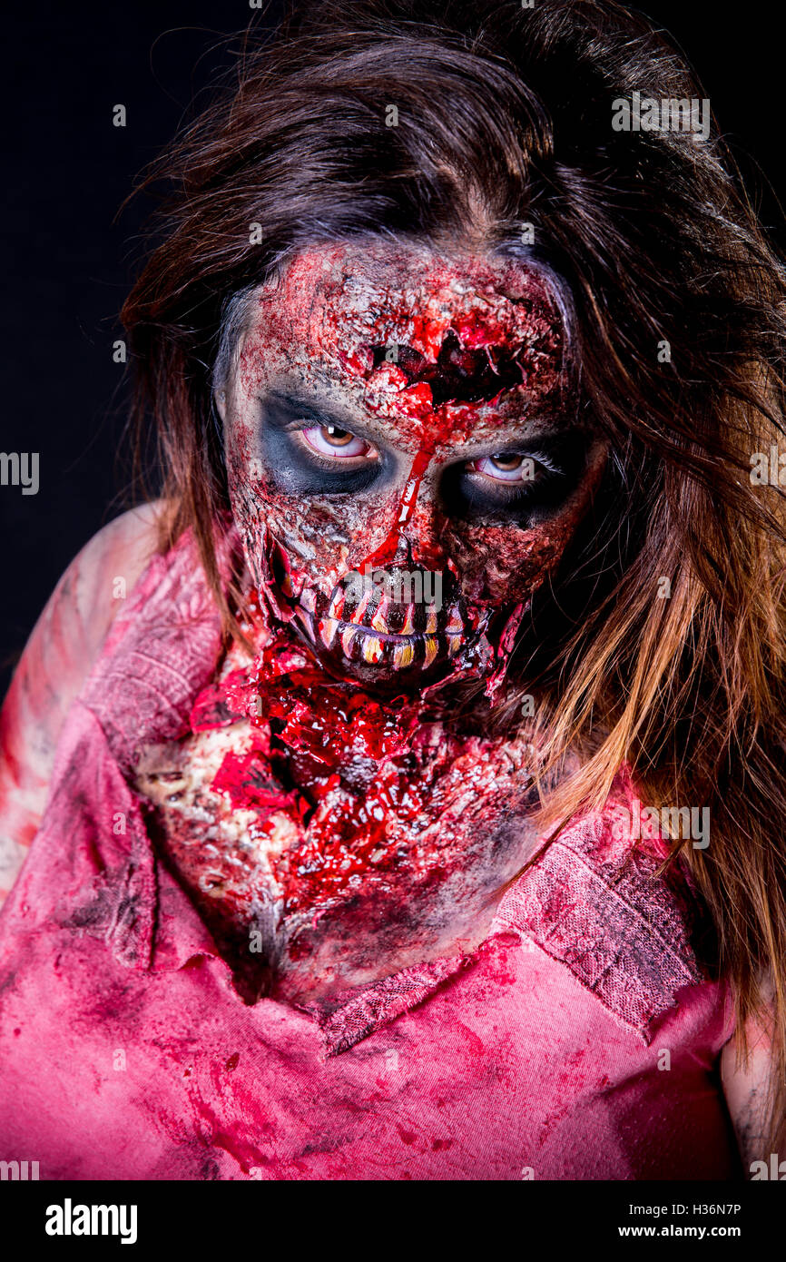 Portrait of zombie girl staring with bloody makeup and latex prosthesis  Stock Photo - Alamy