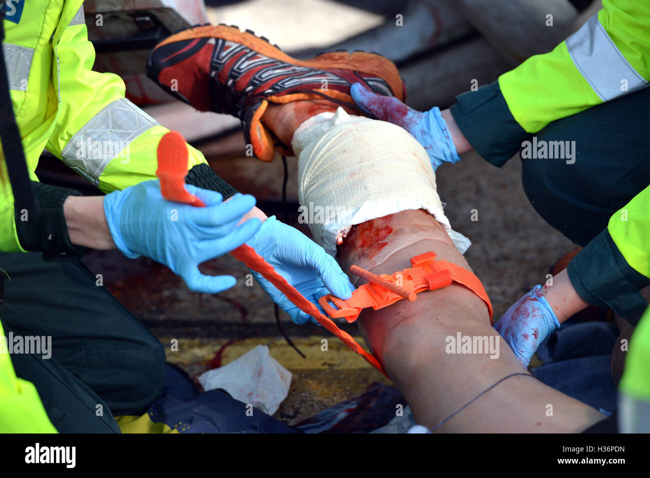Emergency services training exercise with realistic medical dummy - tourniquet Stock Photo