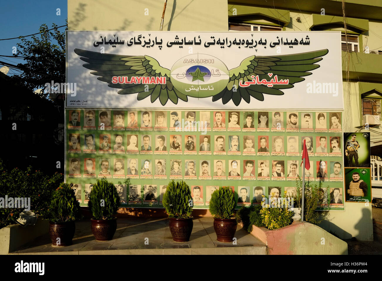 A memorial wall for fallen security personal at the courtyard of the headquarters of the Kurdish intelligence security unit of the Asayiş or Asayish the Kurdish security organization and the primary intelligence agency operating in the Kurdistan region in Iraq. City of Sulaymanieh or Sulaymaniyah Northern Iraq. Stock Photo