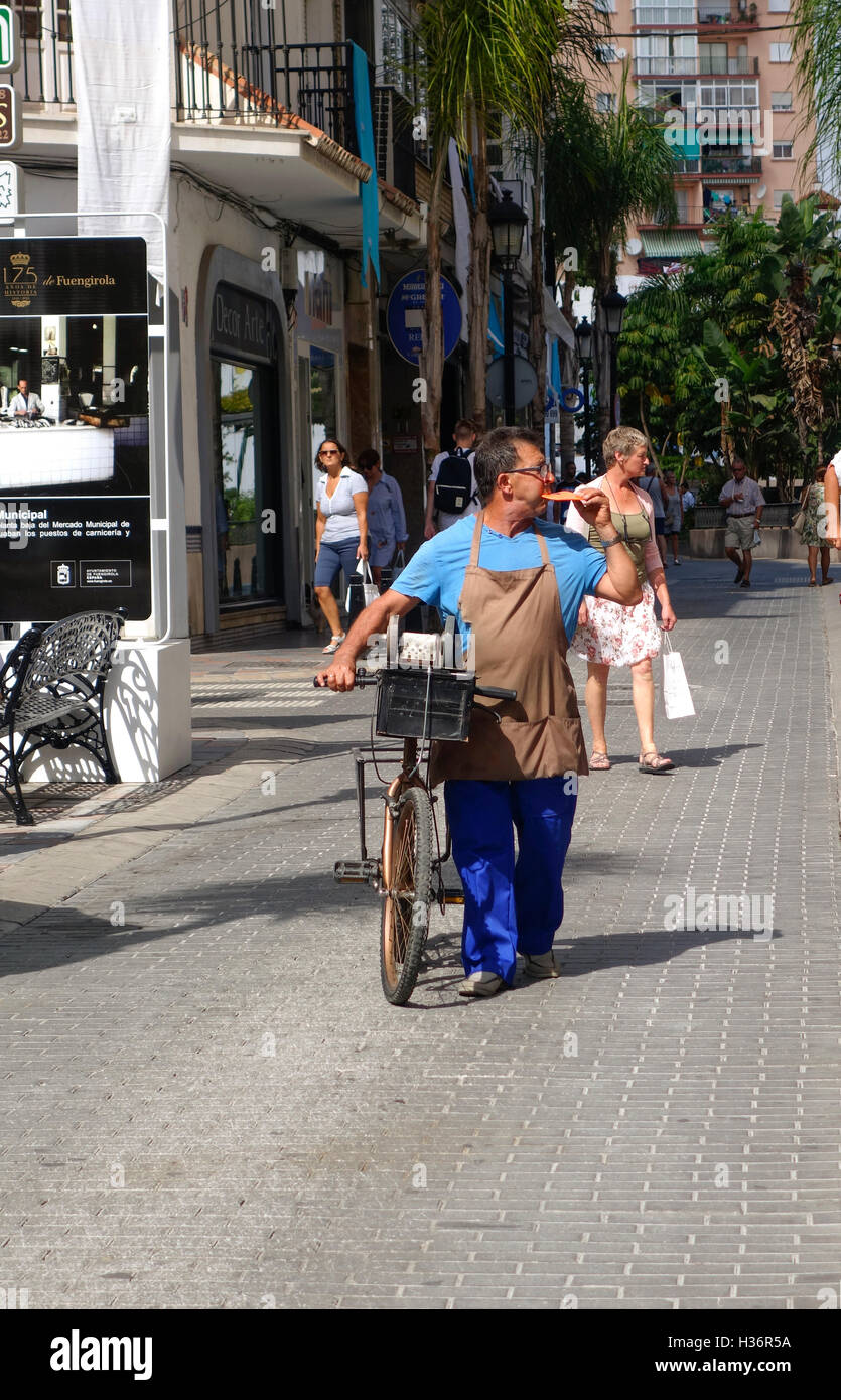 Local spanish knife grinder, knife sharpener, blowing his whistle to